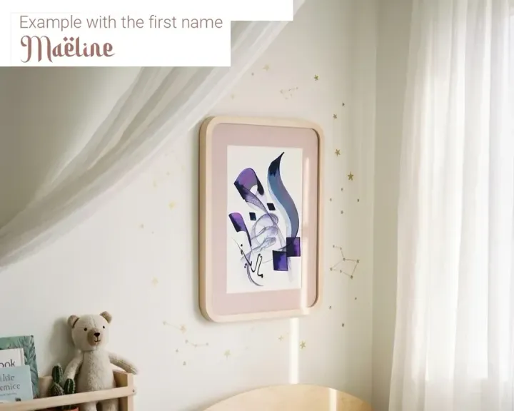 The name Maëline hand-lettered by Zohra, framed in a child's bedroom